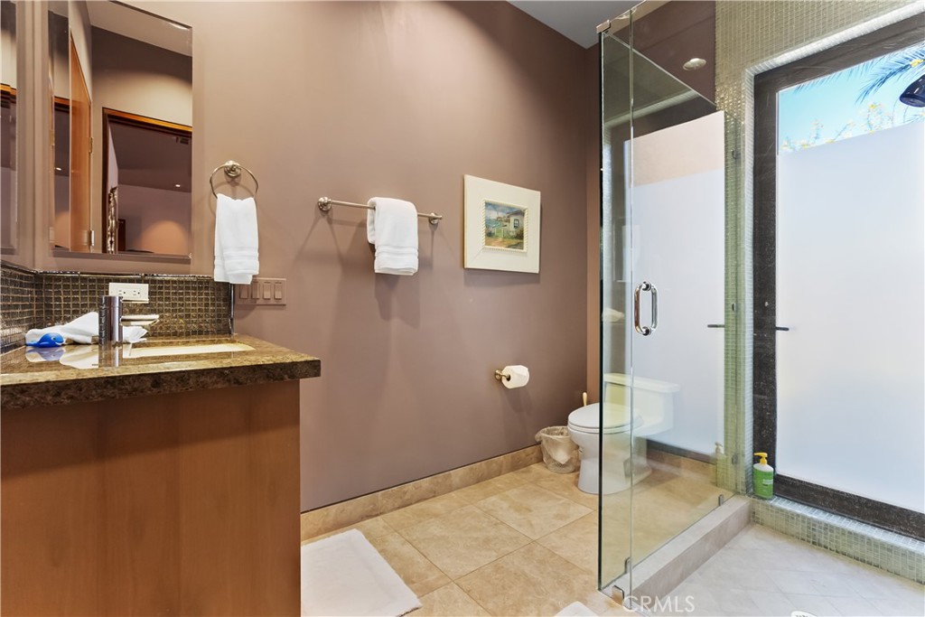 68 Royal St Georges Way Rancho Mirage, CA 92270 - Photo 71 of 75 a bathroom with a sink and a mirror
