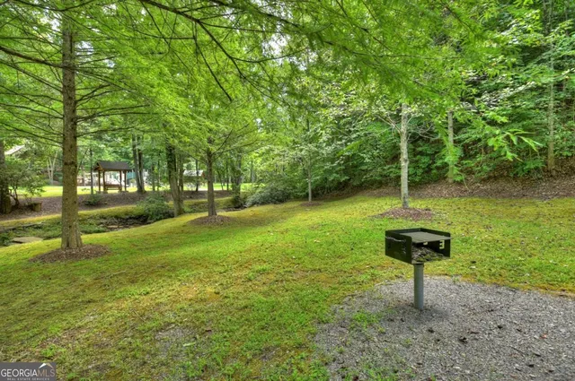 a patio with hardwood table and chairs