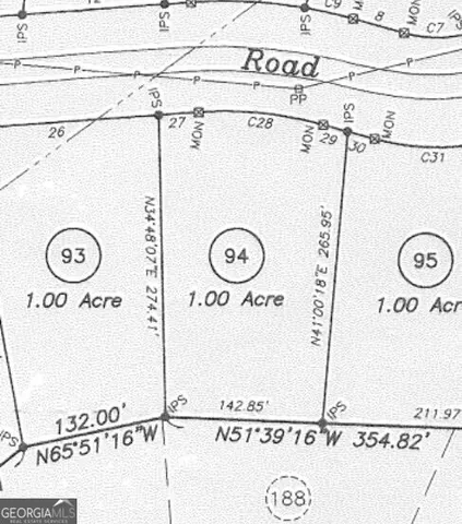 a view of a sitting area with large trees