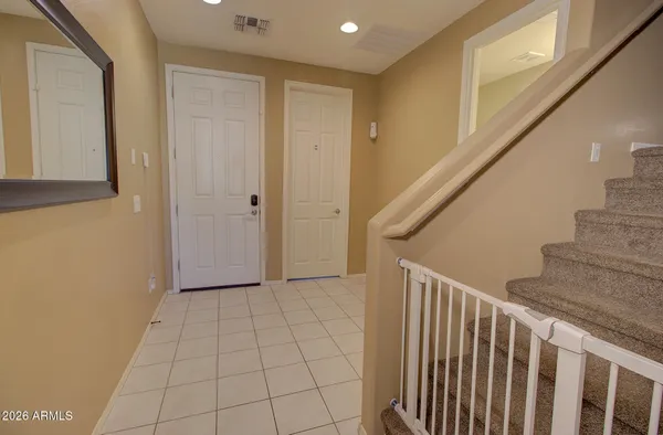 a view of entryway with stairs and wooden floor