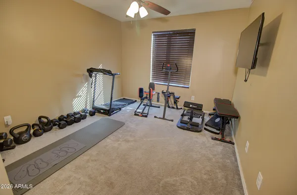 a room with furniture closet and a flat screen tv