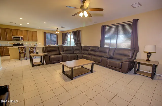 a living room with furniture and a window