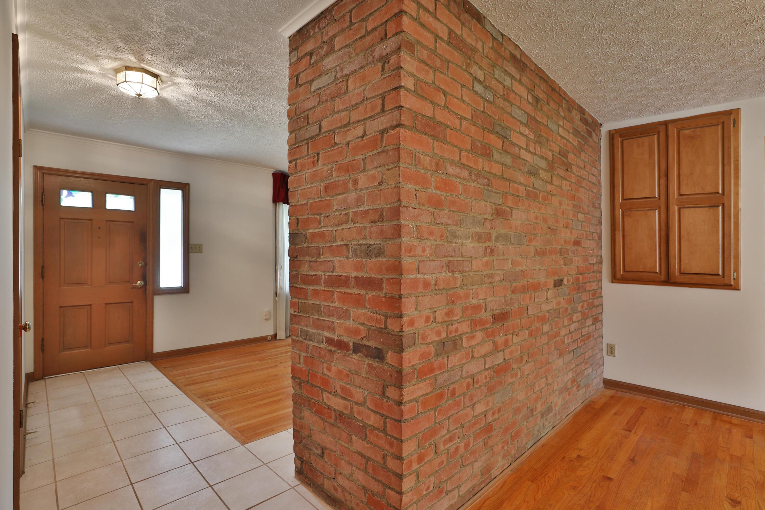 4249 Rowanne Road Columbus, OH 43214 - Photo 11 of 40 Brick wall in Dining Room