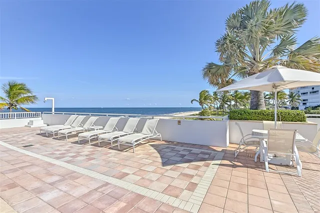 a view of swimming pool with lounge chair