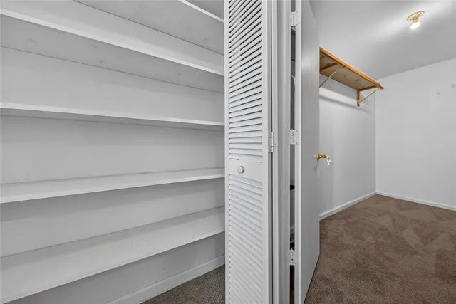 a view of a hallway with closet