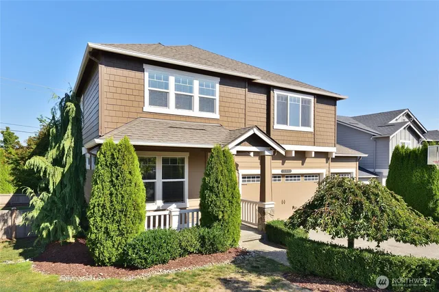 a front view of a house with garden