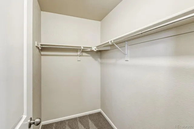 a view of an empty walk in closet