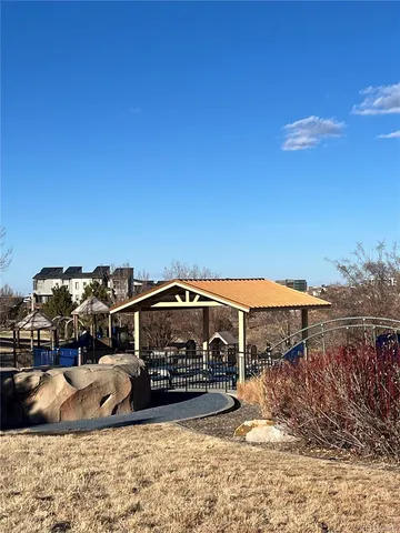 a view of a town with big trees