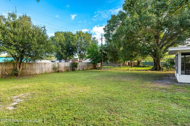 a view of a trees in front of a house