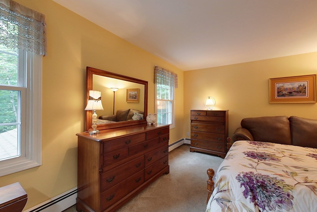 95 Clement Road Townsend, MA 01474 - Photo 27 of 42 a bedroom with a bed and a dresser