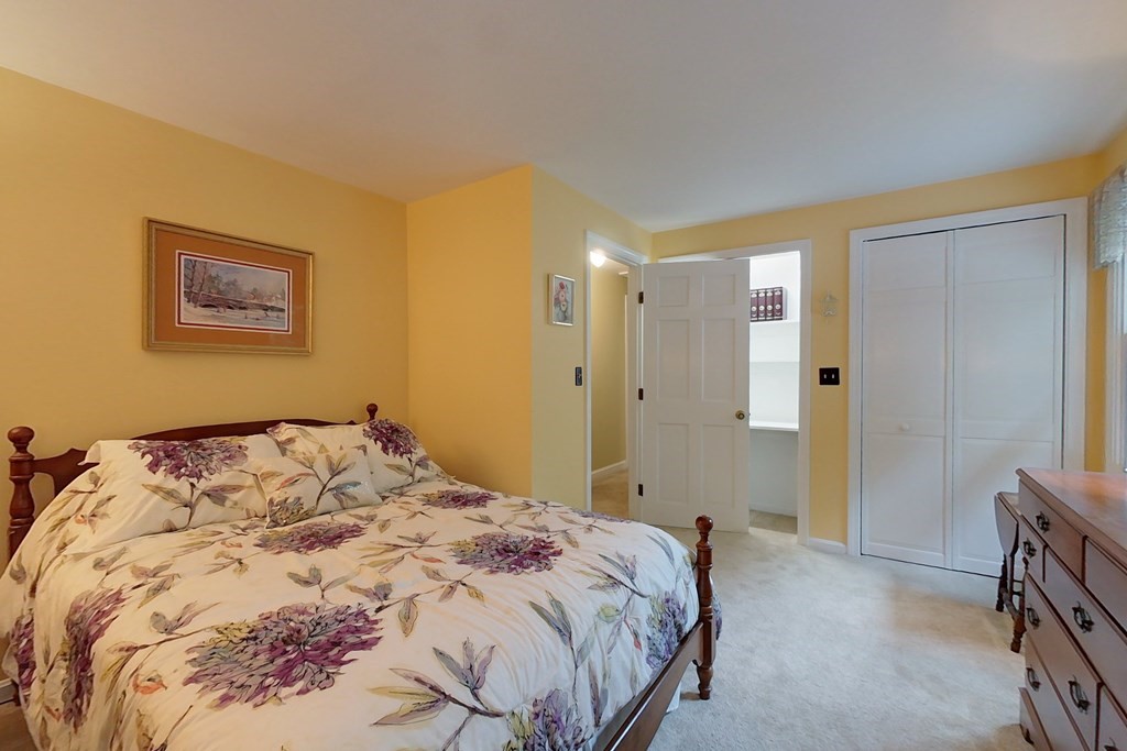 95 Clement Road Townsend, MA 01474 - Photo 29 of 42 a bedroom with a bed and a painting on the wall