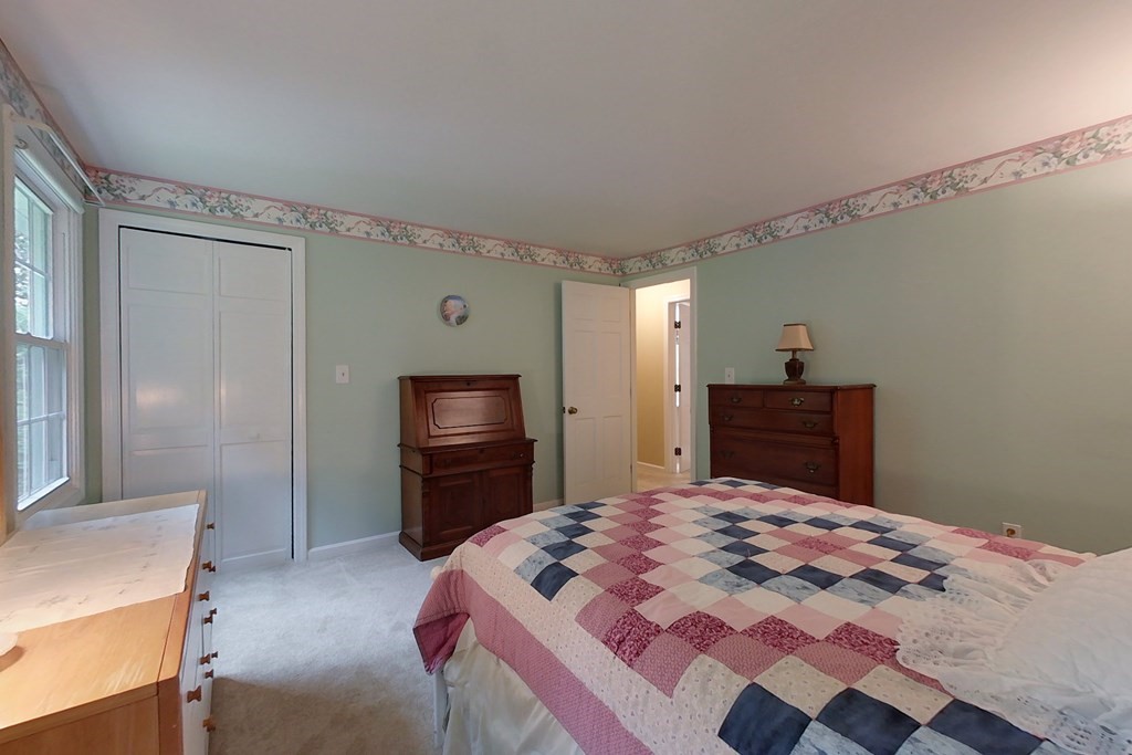95 Clement Road Townsend, MA 01474 - Photo 30 of 42 a bedroom with a bed and a television