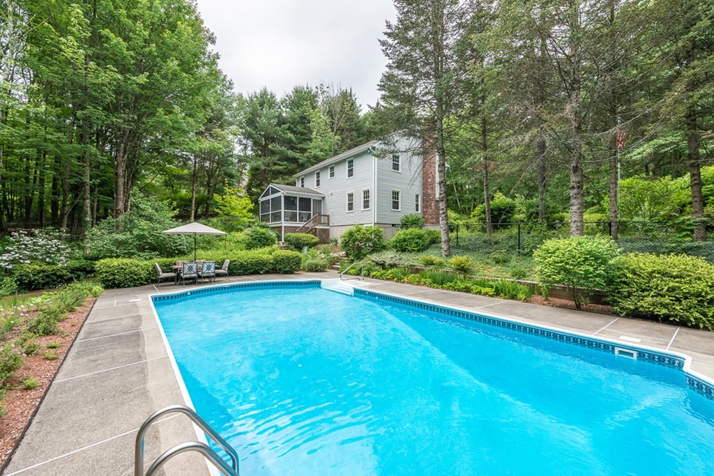 95 Clement Road Townsend, MA 01474 - Photo 3 of 42 a view of backyard with potted plants and a large tree