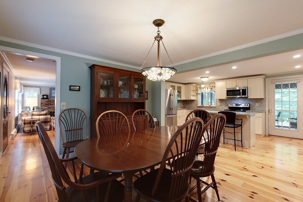 95 Clement Road Townsend, MA 01474 - Photo 8 of 42 a dining room with furniture a chandelier and wooden floor