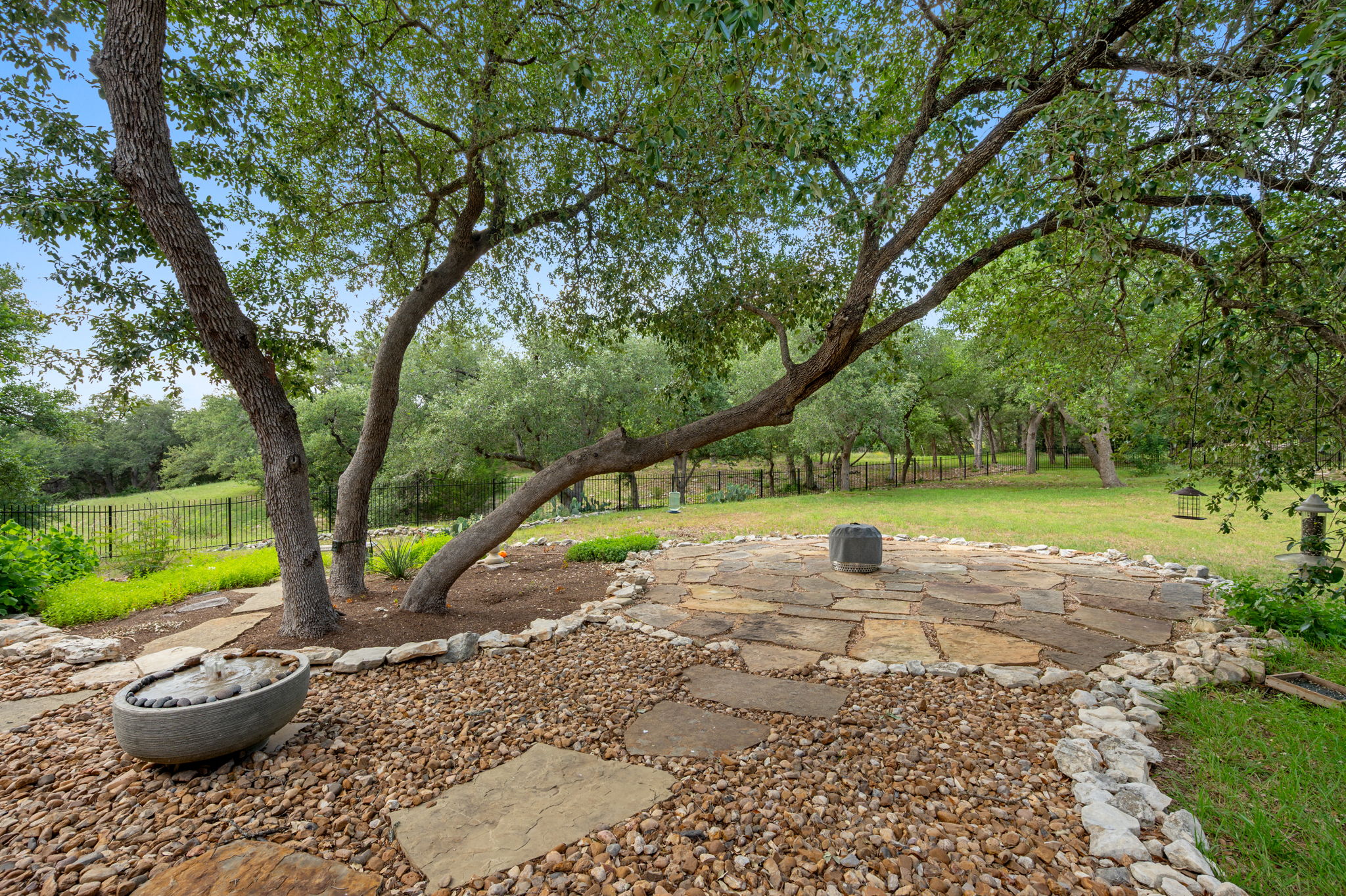 212 Marbella Way Georgetown, TX 78633 - Photo 34 of 40 a view of a garden with large trees