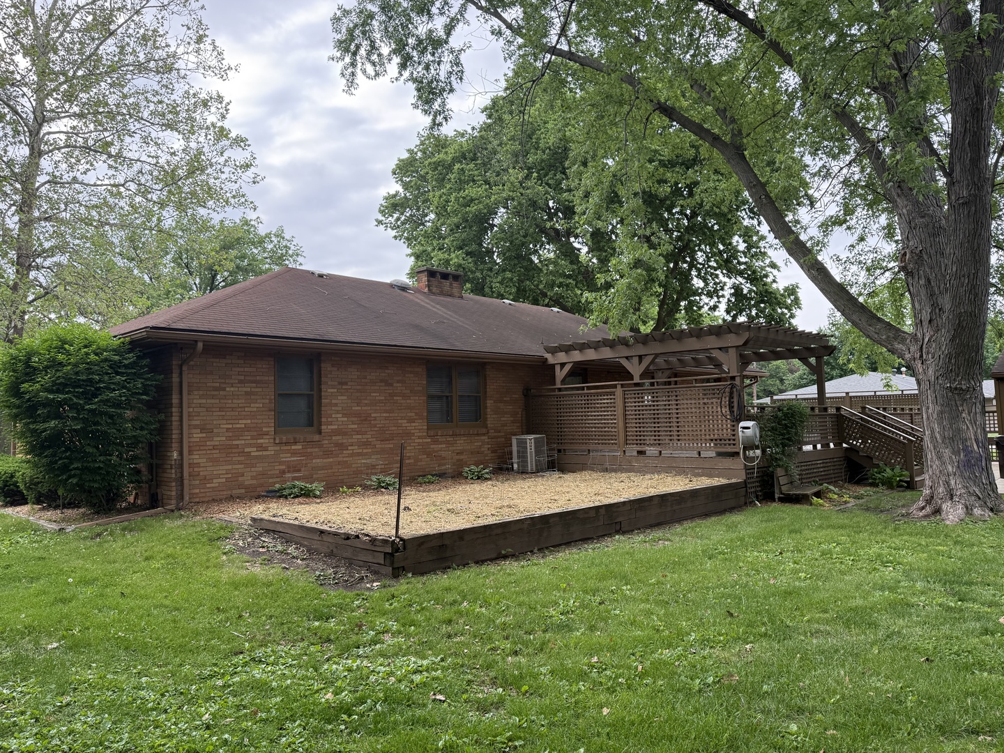 1048 Warren Street Henry, IL 61537 - Photo 5 of 26 a view of a house with a yard and sitting area