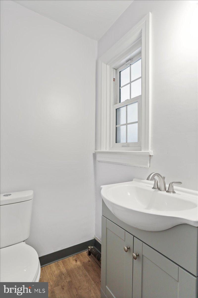 19011 Orchard Terrace Road Hagerstown, MD 21742 - Photo 20 of 41 a bathroom with a sink toilet and mirror