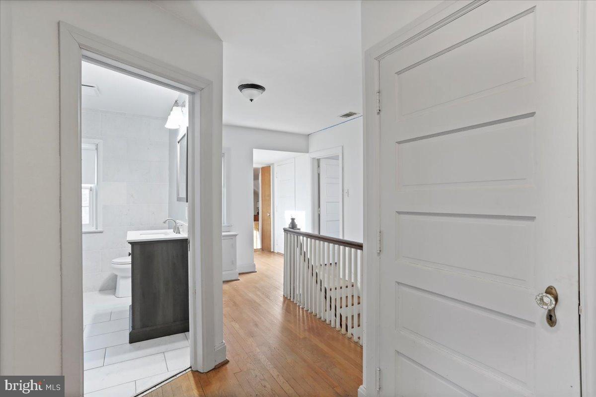 19011 Orchard Terrace Road Hagerstown, MD 21742 - Photo 26 of 41 a view of a hallway with wooden floor and staircase