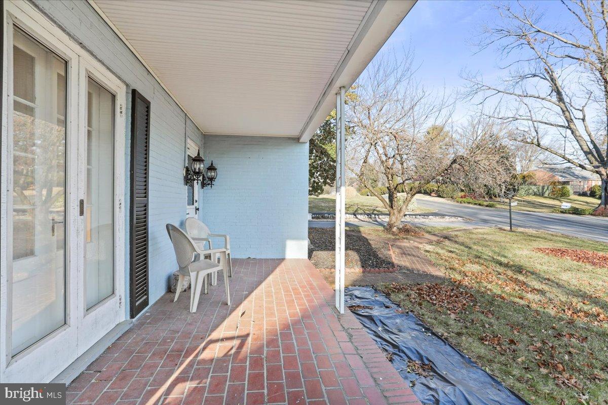 19011 Orchard Terrace Road Hagerstown, MD 21742 - Photo 3 of 41 a view of a balcony with mountain view and wooden floor