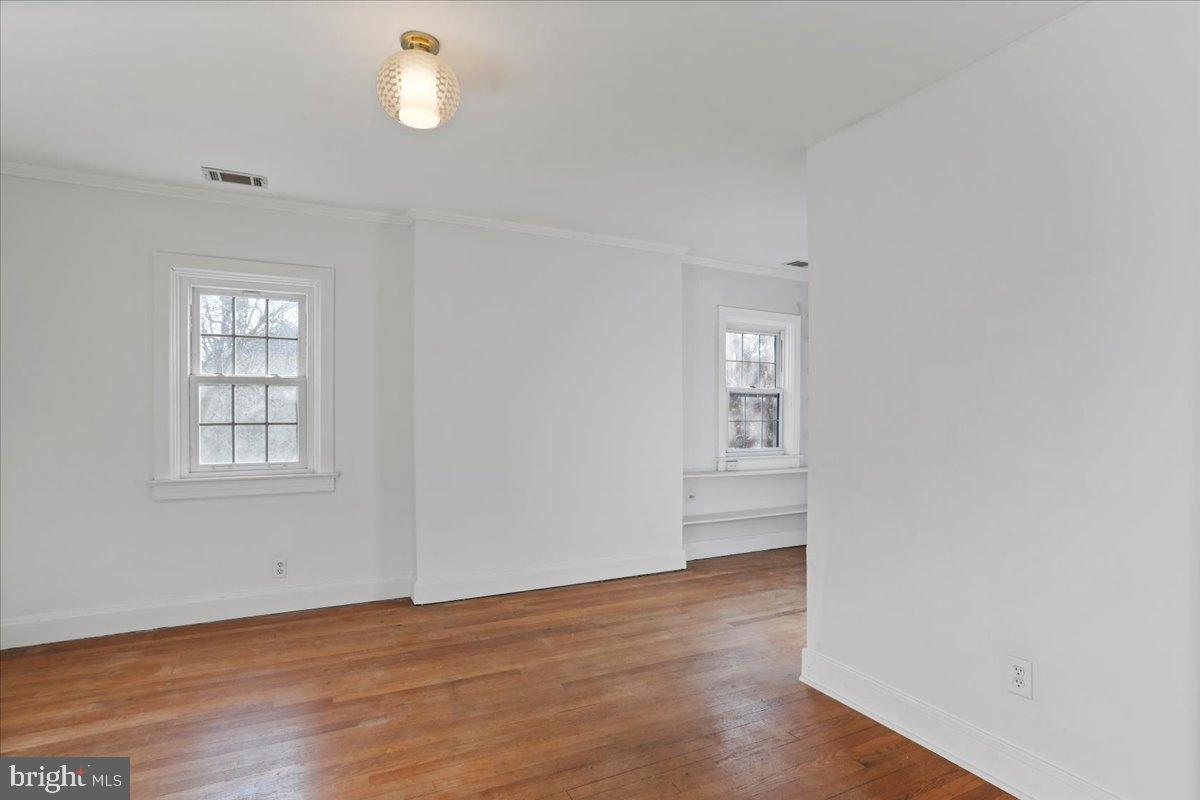19011 Orchard Terrace Road Hagerstown, MD 21742 - Photo 31 of 41 an empty room with wooden floor and windows
