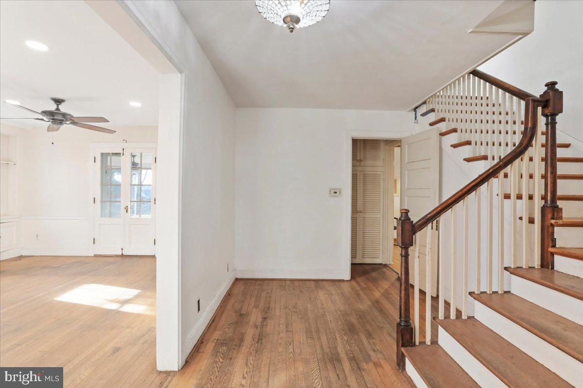 19011 Orchard Terrace Road Hagerstown, MD 21742 - Photo 5 of 41 a view of a hallway with wooden floor and staircase