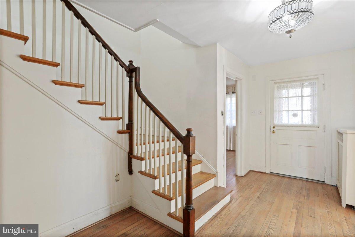 19011 Orchard Terrace Road Hagerstown, MD 21742 - Photo 6 of 41 a view of an entryway with wooden floor and stairs