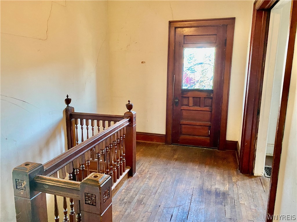 402 Baynes Street Buffalo, NY 14213 - Photo 17 of 37 Upper Apartment: Wood carved banister, pocket doo