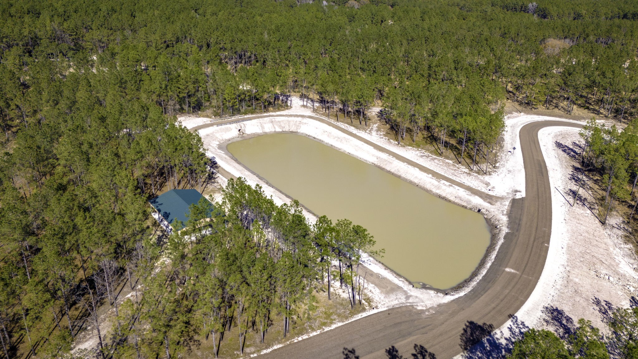 41 Sportsman Retreat Road Onalaska, TX 77360 - Photo 13 of 16 a view of a swimming pool with a garden