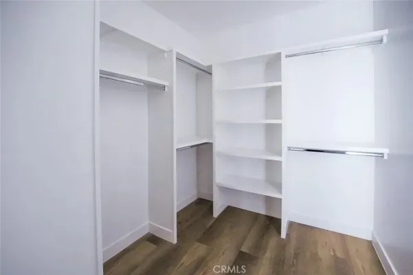 a bathroom with a granite countertop sink a vanity and a large mirror