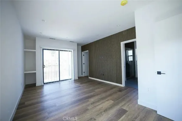 a view of a hallway with washer and dryer