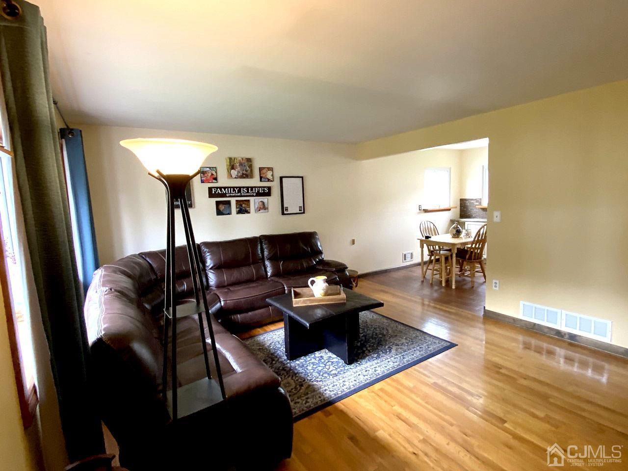 169 McFarlane Road Colonia, NJ 07067 - Photo 6 of 11 a living room with furniture and a wooden floor