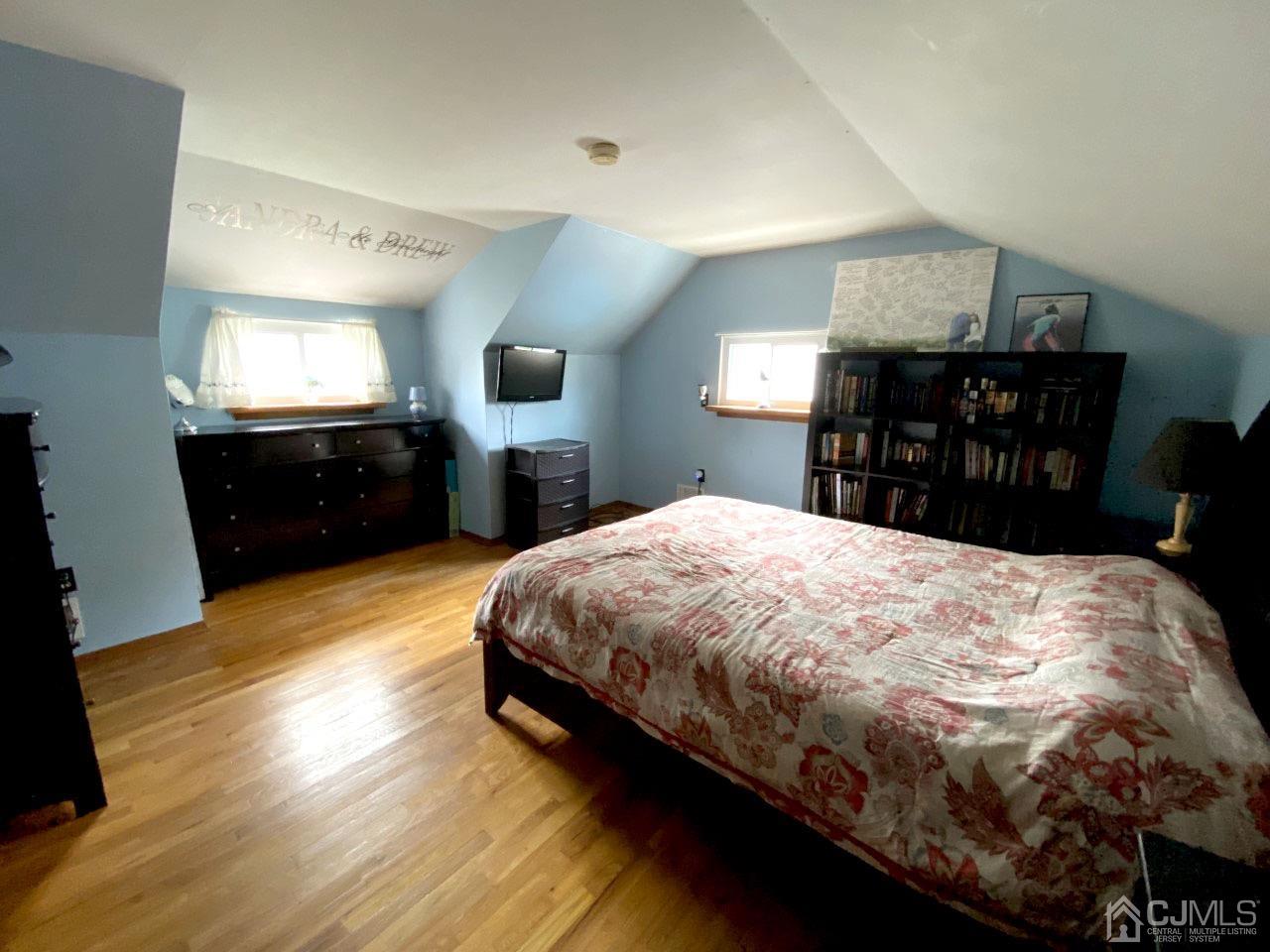 169 McFarlane Road Colonia, NJ 07067 - Photo 10 of 11 a bed sitting in a bedroom with a kitchen