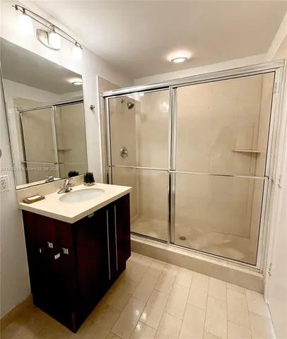 a bathroom with a sink and mirror