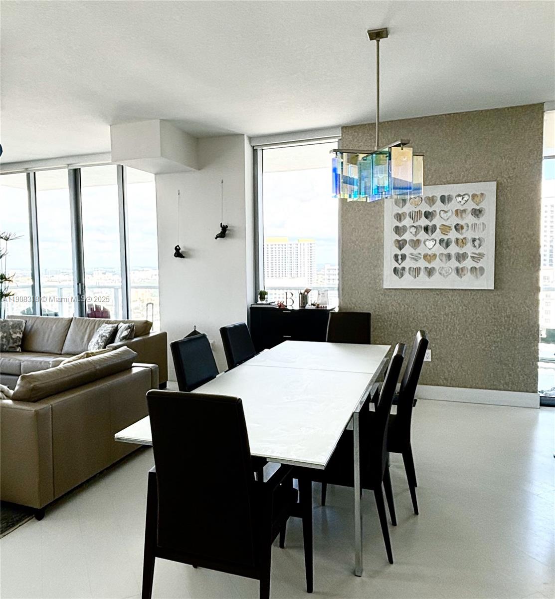79 Southwest 12th Street, Unit 4012S Miami, FL 33130 - Photo 2 of 34 a view of a dining room with furniture