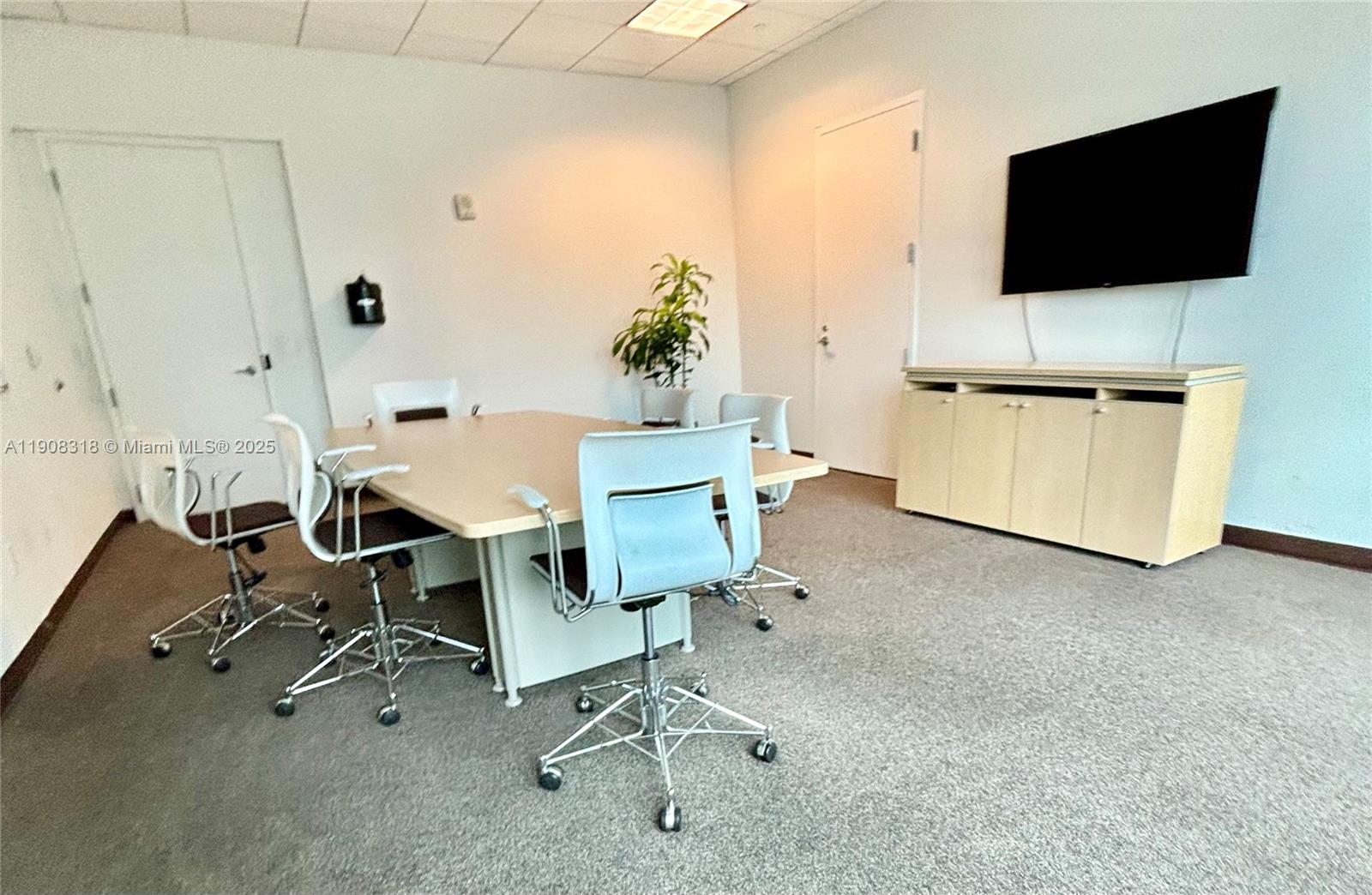 79 Southwest 12th Street, Unit 4012S Miami, FL 33130 - Photo 29 of 34 a view of a livingroom with furniture and a flat screen tv