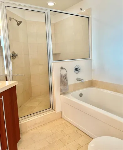 a bathroom with a bathtub and a shower