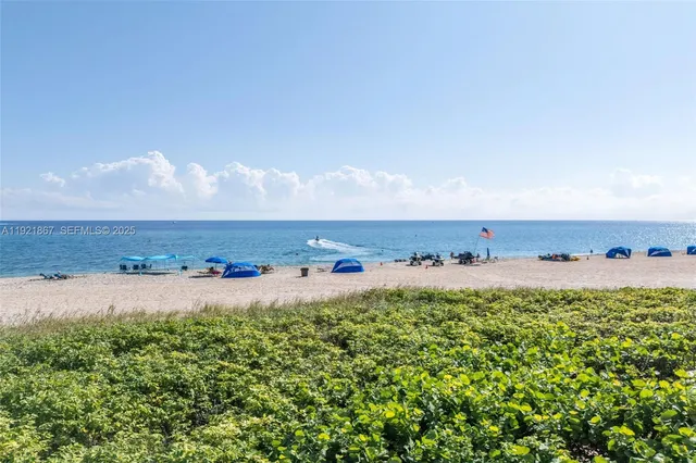 a bathroom with a bathtub a sink and a mirror