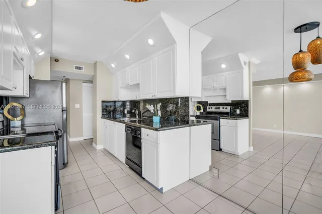 a view of a balcony with lake view and a potted plant