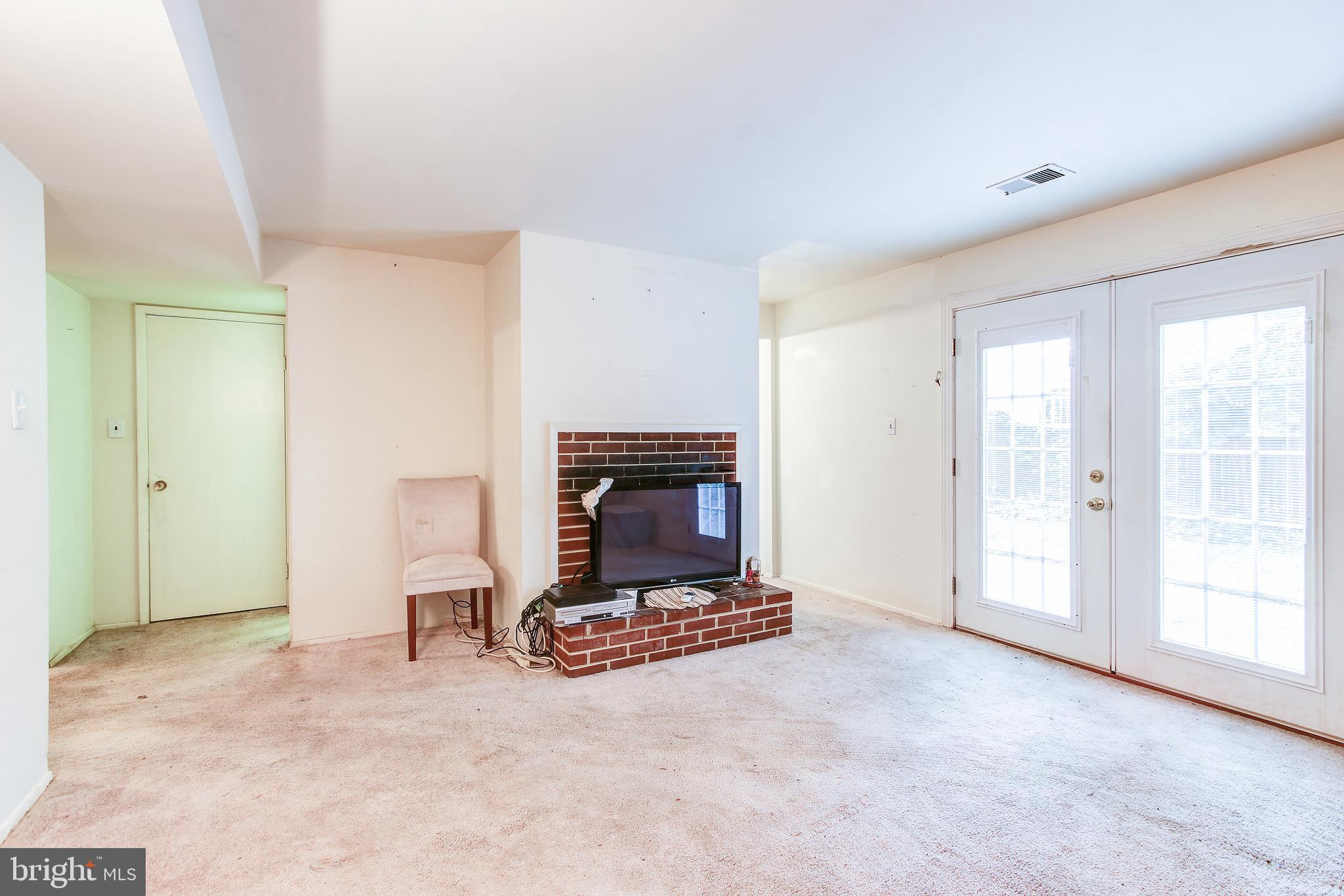 12916 Clarion Road Fort Washington, MD 20744 - Photo 15 of 35 Main level family room with fireplace.