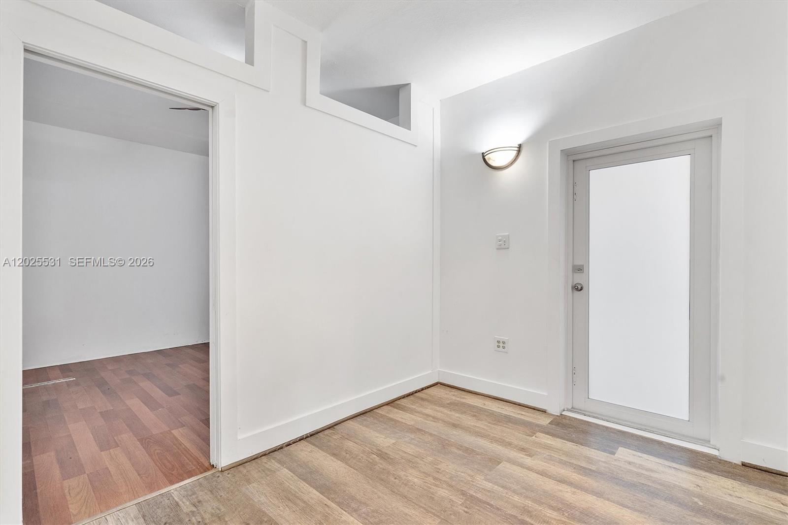 3951 Southwest 2nd Terrace, Unit 3951 Miami, FL 33134 - Photo 15 of 21 a view of an empty room with wooden floor