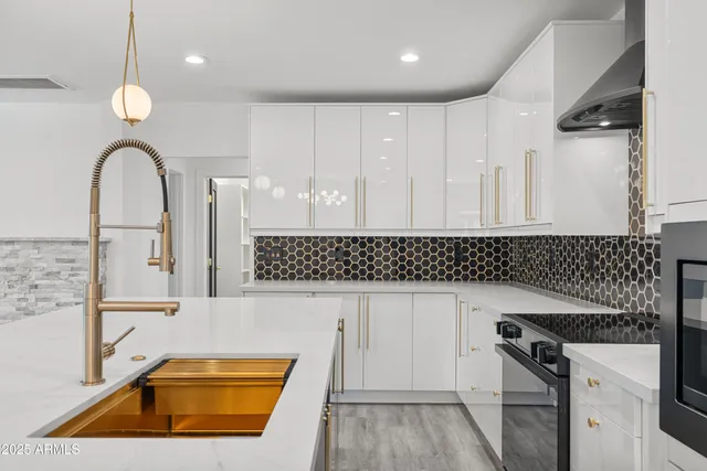 a kitchen with a sink and a refrigerator