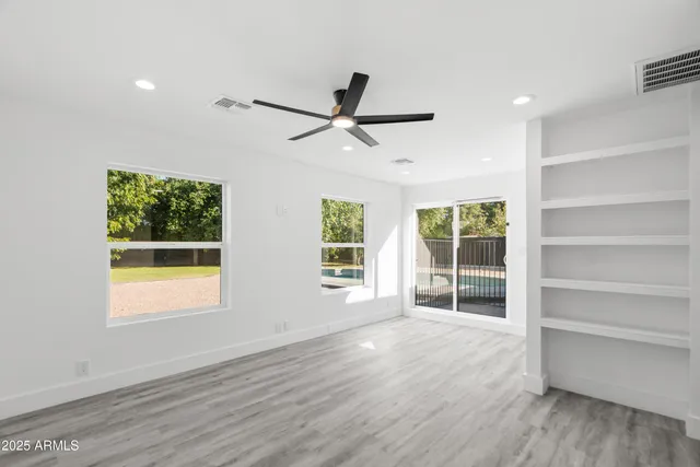 a kitchen with a sink a stove and cabinets