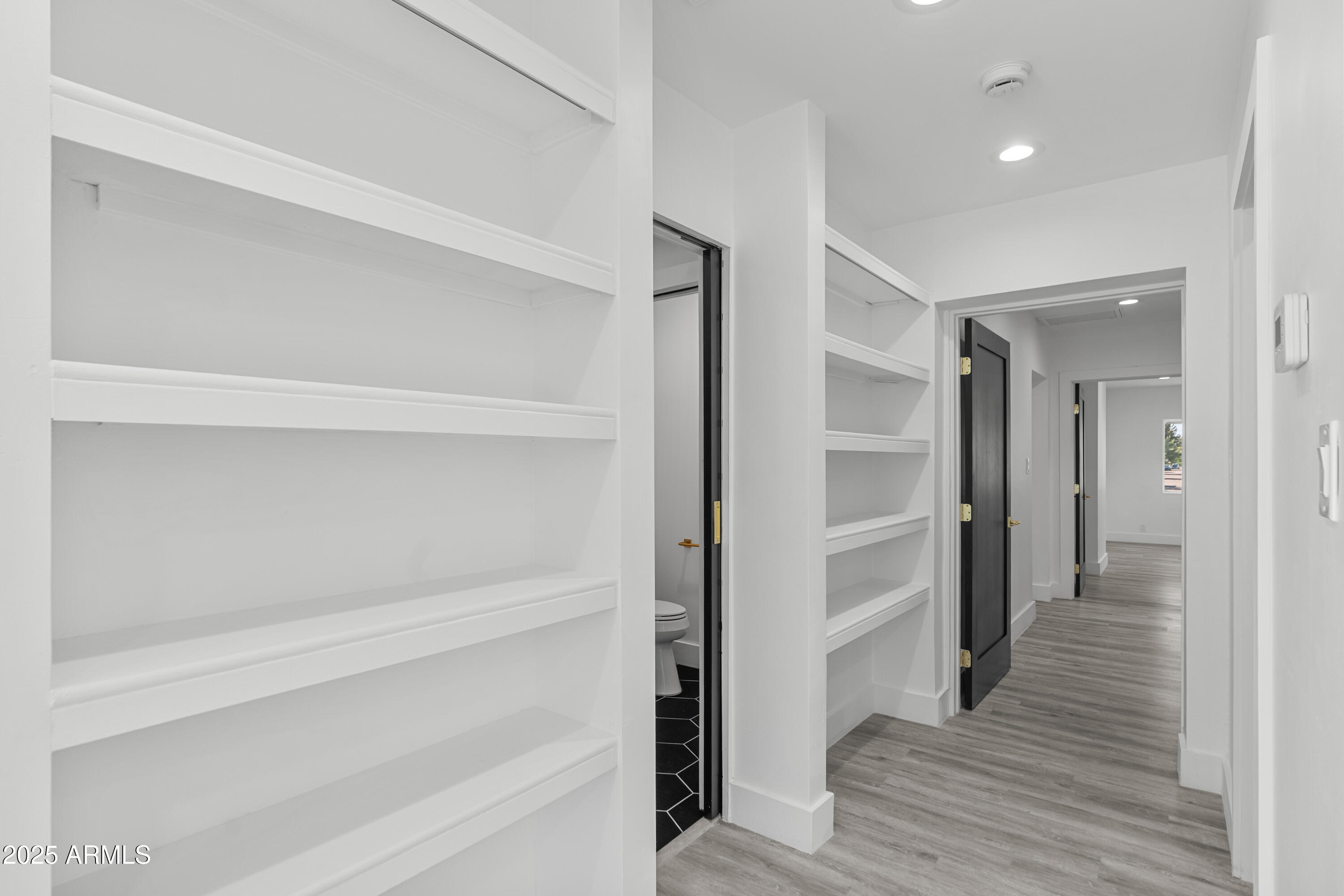 2502 East Whitton Avenue Phoenix, AZ 85016 - Photo 14 of 34 a view of a hallway with wooden floor and closet