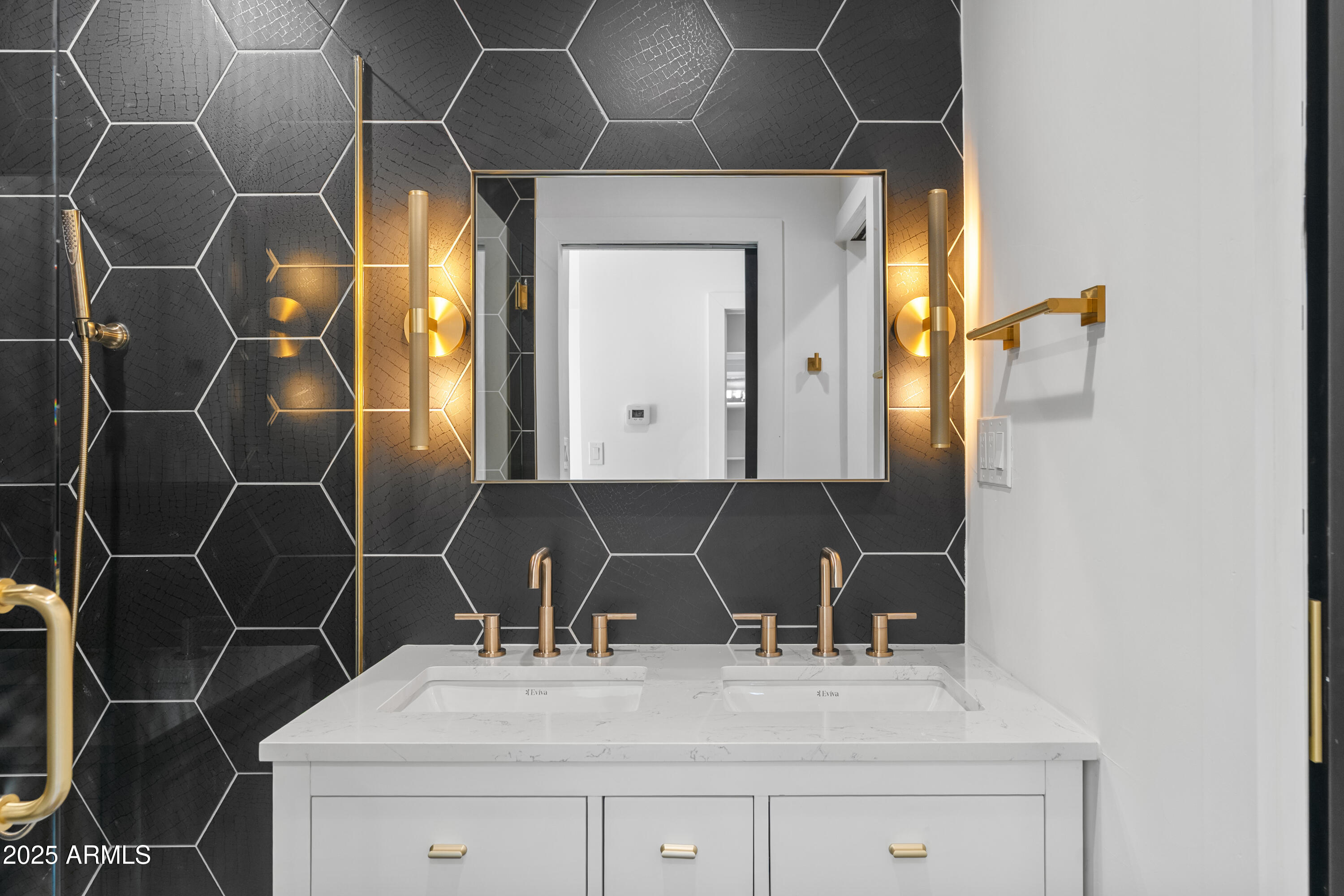 2502 East Whitton Avenue Phoenix, AZ 85016 - Photo 15 of 34 a bathroom with a sink and a mirror