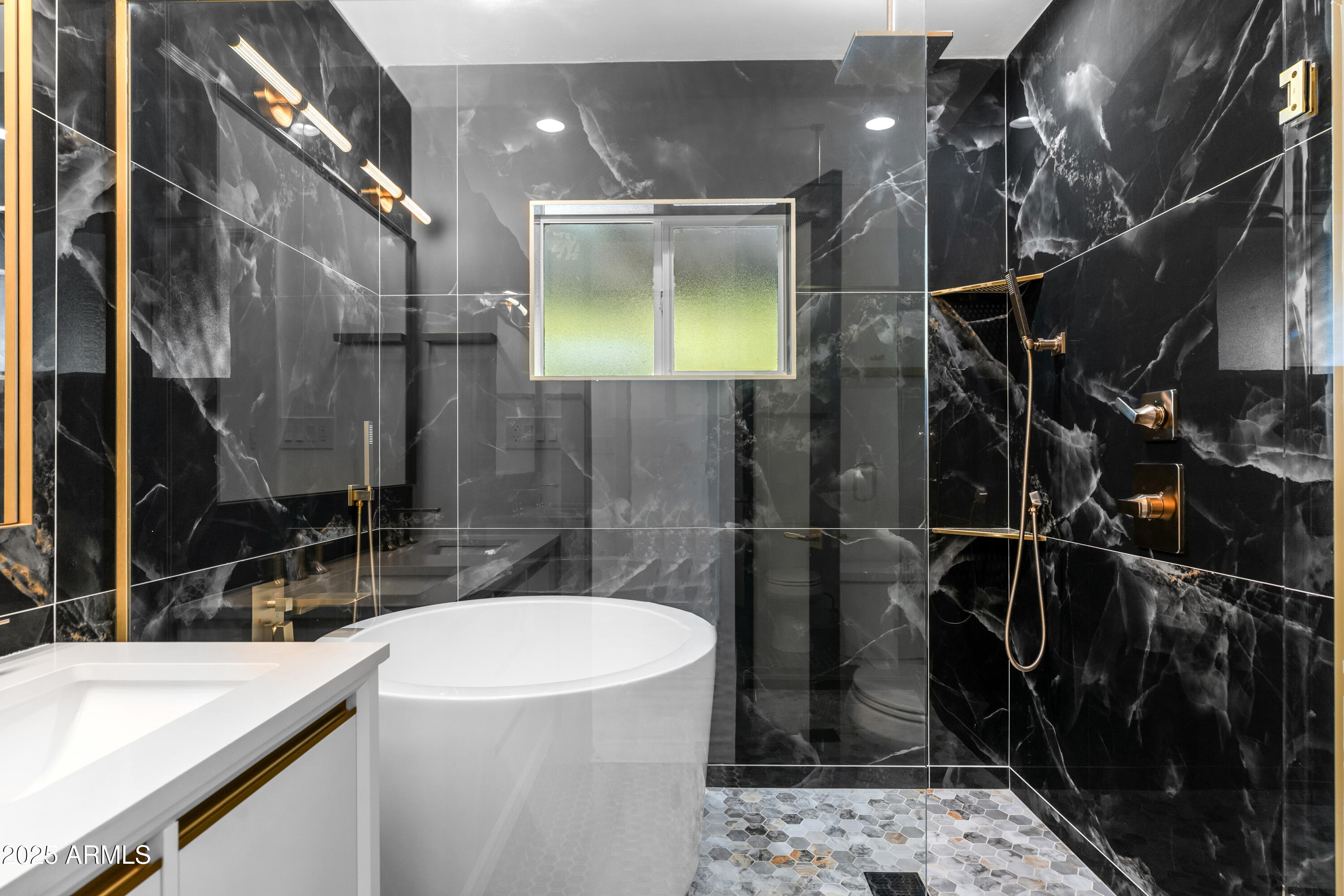 2502 East Whitton Avenue Phoenix, AZ 85016 - Photo 21 of 34 a bathroom with a sink a toilet and shower