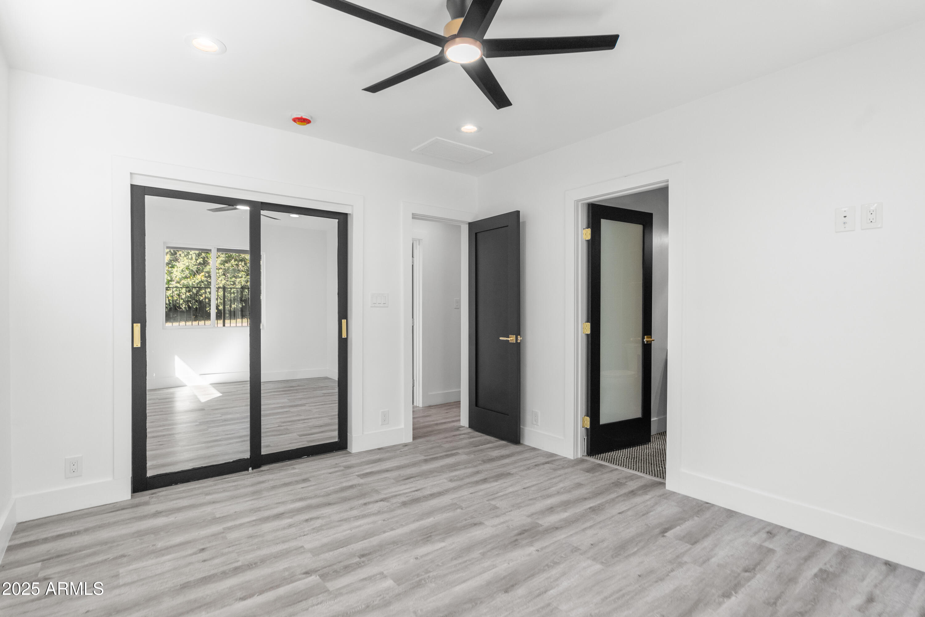 2502 East Whitton Avenue Phoenix, AZ 85016 - Photo 23 of 34 a view of empty room with wooden floor