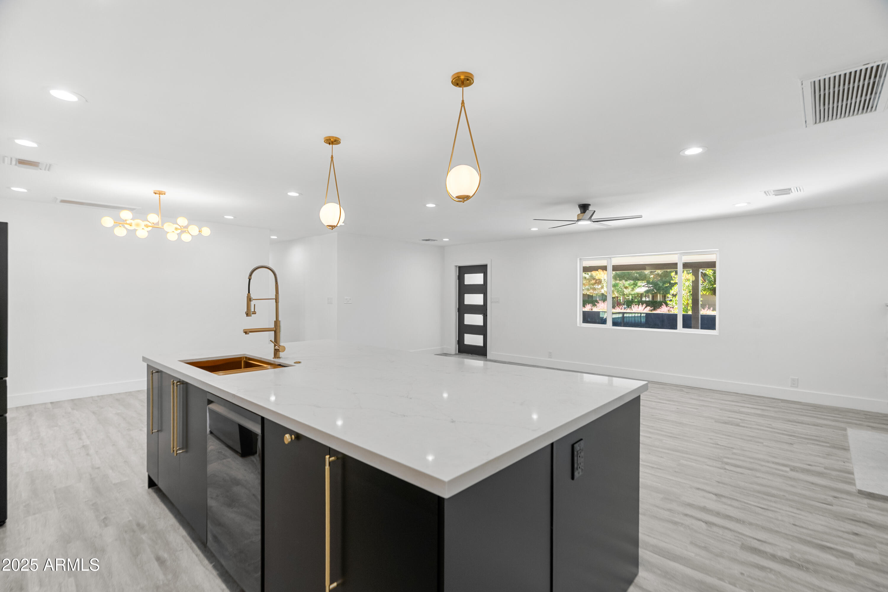 2502 East Whitton Avenue Phoenix, AZ 85016 - Photo 9 of 34 a kitchen with a sink and a refrigerator