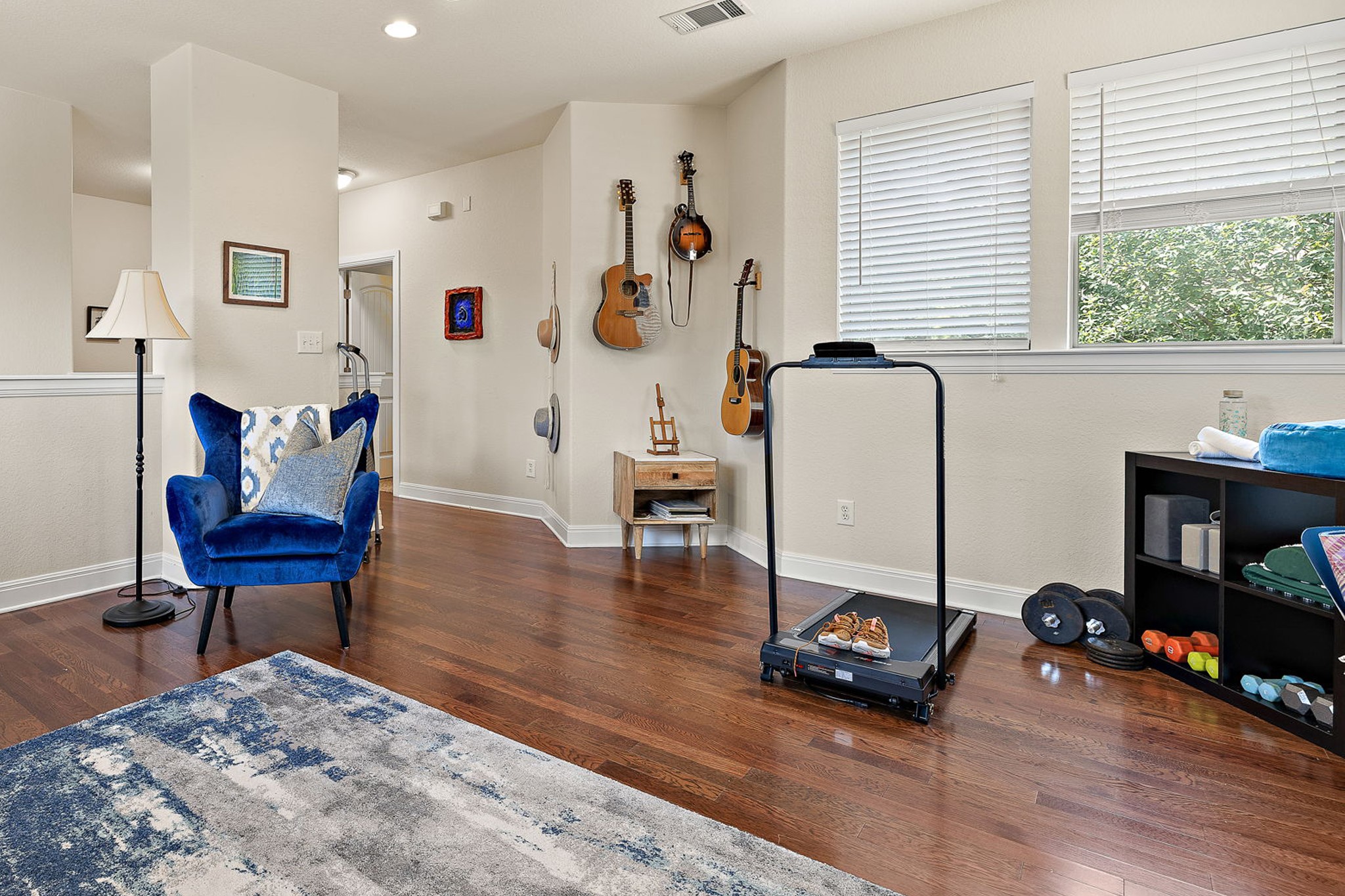 6708 Menchaca Road, Unit 10 Austin, TX 78745 - Photo 14 of 28 Rich wood-finish flooring throughout, recessed lighting, and multiple windows with white blinds
