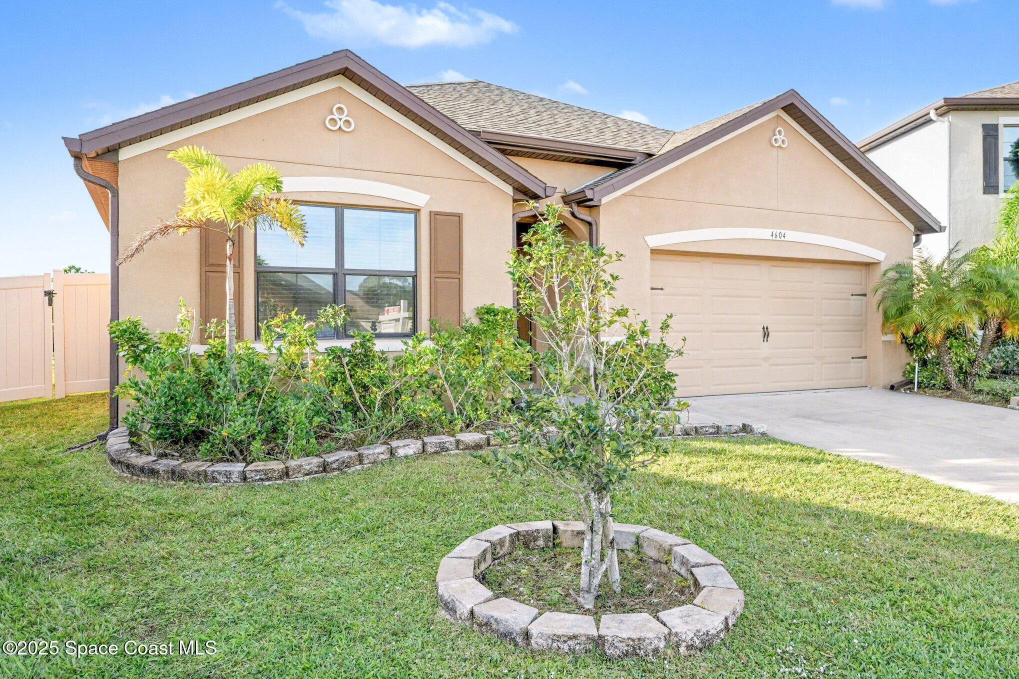 4604 Magenta Isles Drive Melbourne, FL 32904 - Photo 2 of 17 a front view of a house with a yard