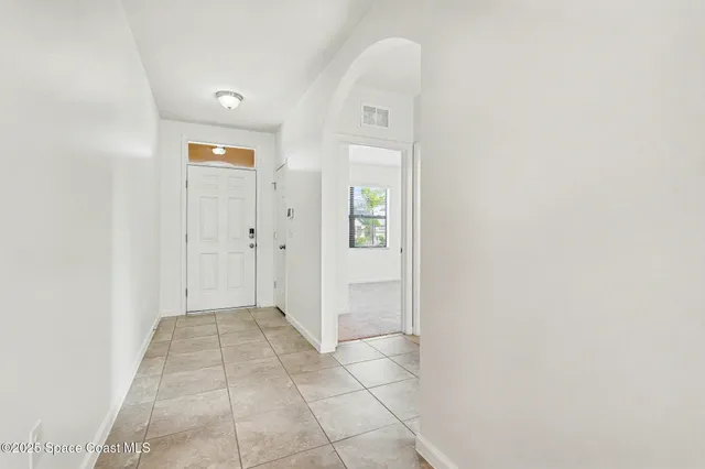 an empty room with mirror